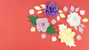Colorful paper flowers in purple, white, and yellow.