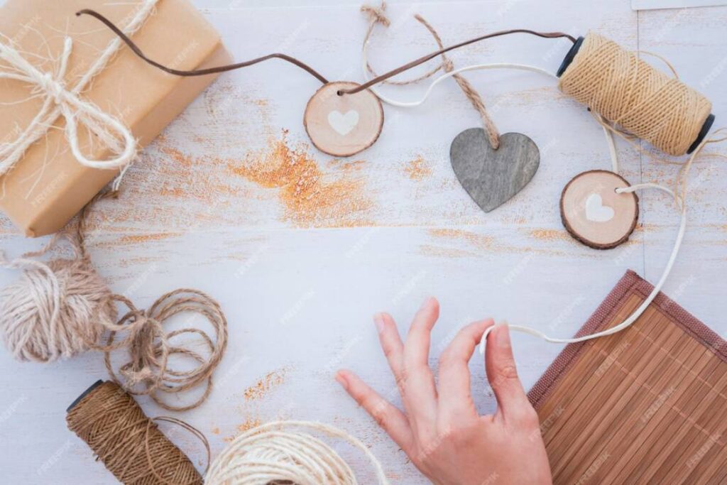A hand reaches for crafting supplies.